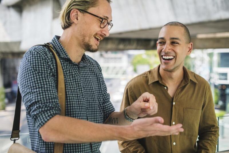 Two People Speaking Enthusiastically to One Another 